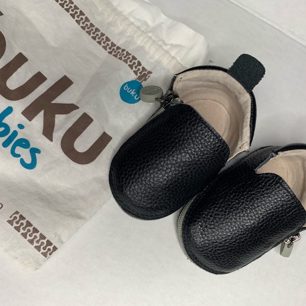 Buku Shoes | A black genuine leather bootie.